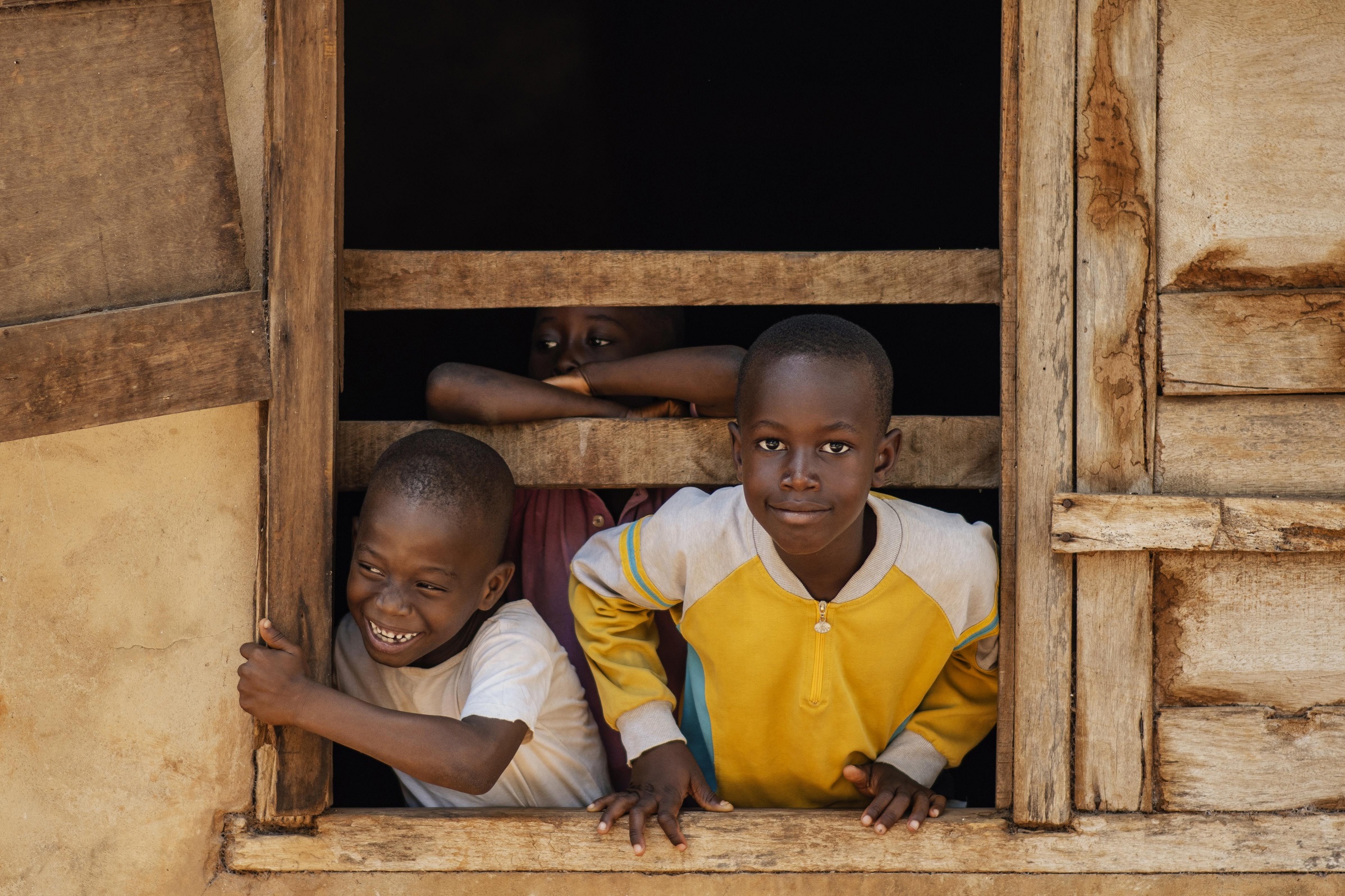 Students with new school supplies in Uganda